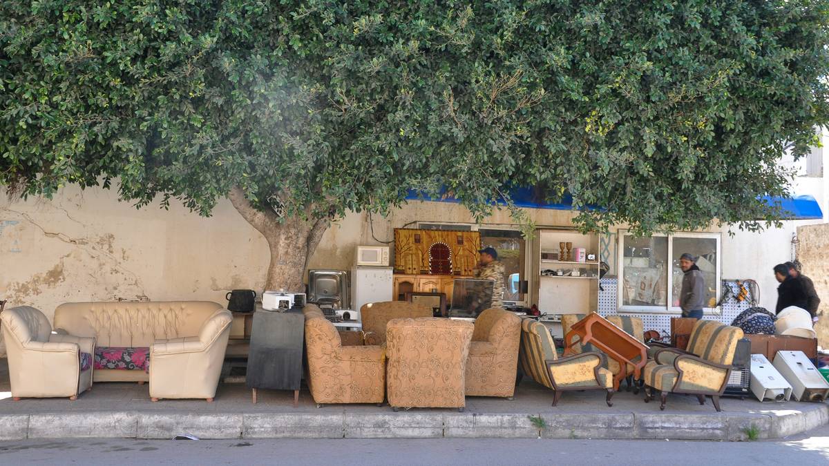 Durable garden centre outdoor furniture set featuring teak chairs and aluminum frame table on a stone patio