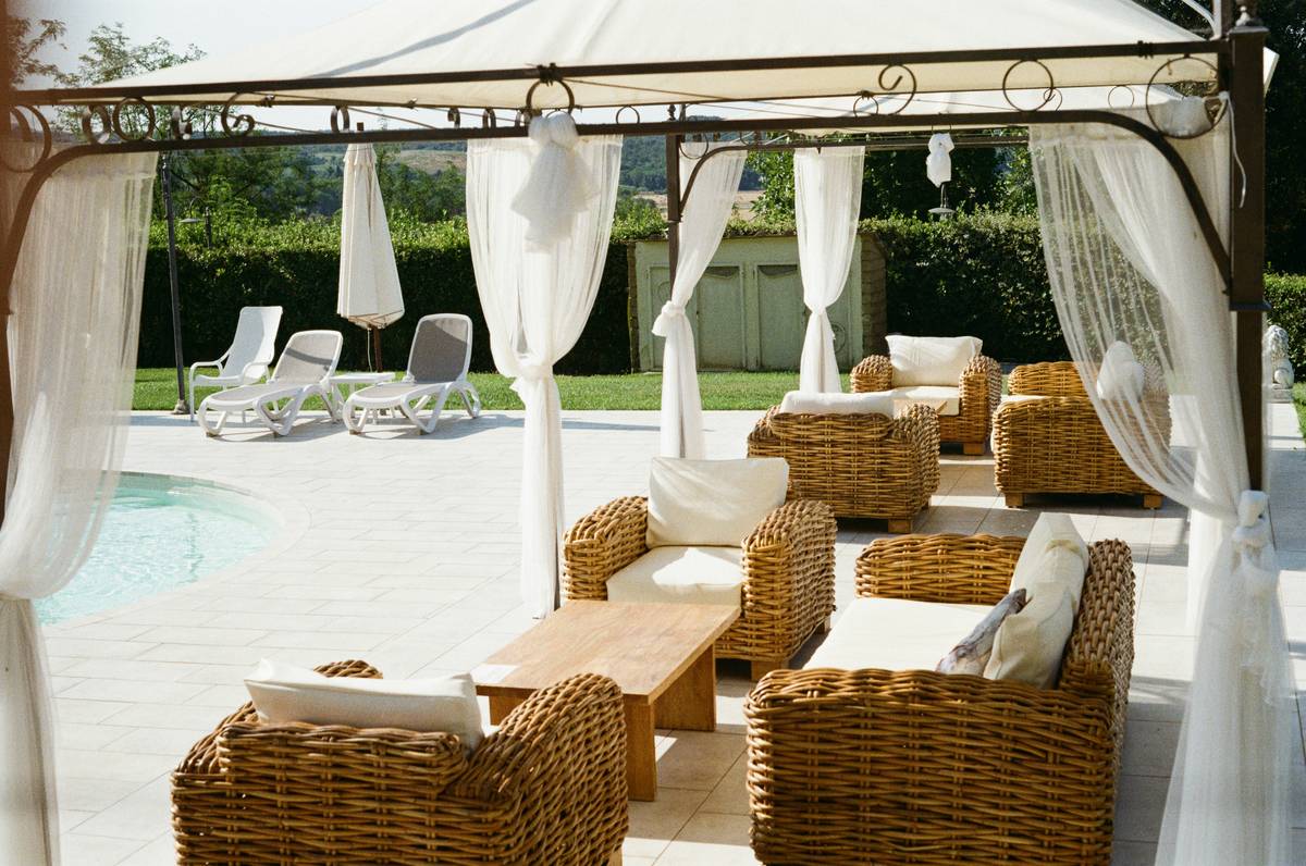 chair king outdoor furniture showing durable teak frame with weather-resistant cushions on a sunlit patio